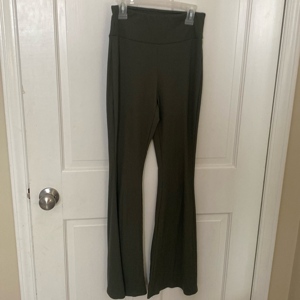 Green flared leggings